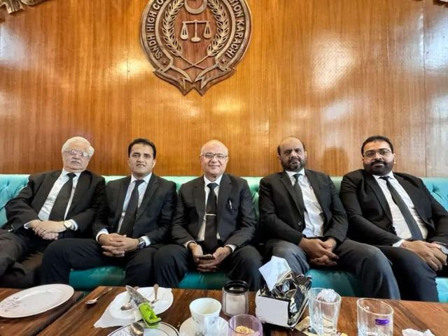 Advocates seated together beneath the Sindh High Court Bar Association emblem
