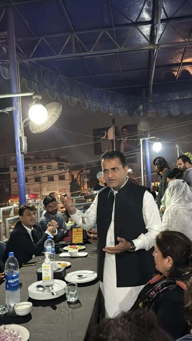 An advocate addressing a gathering at an evening event