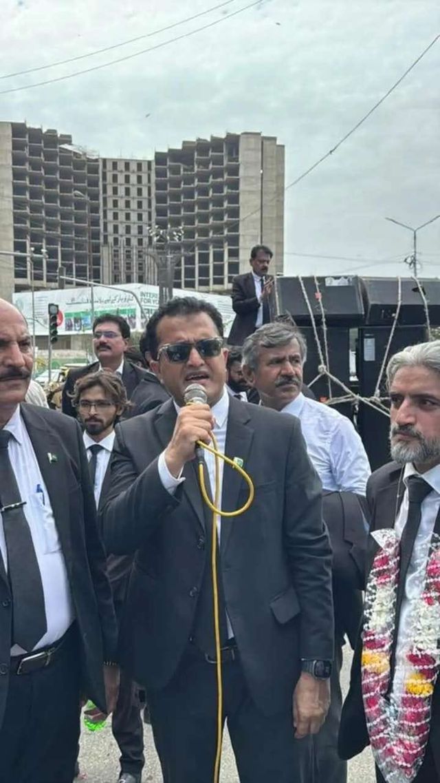 An advocate speaking at an outdoor gathering