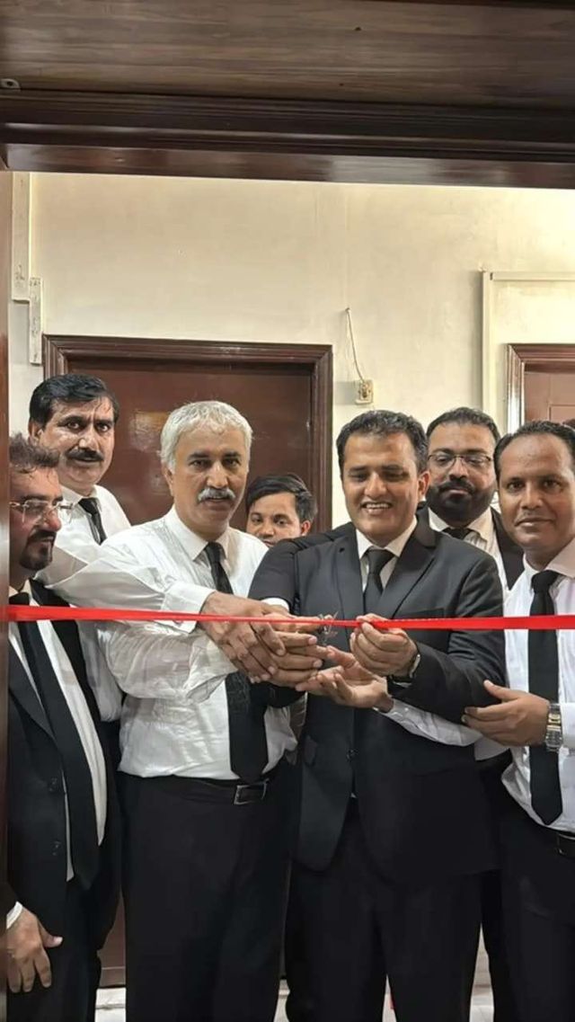 A ribbon-cutting ceremony with advocates and guests