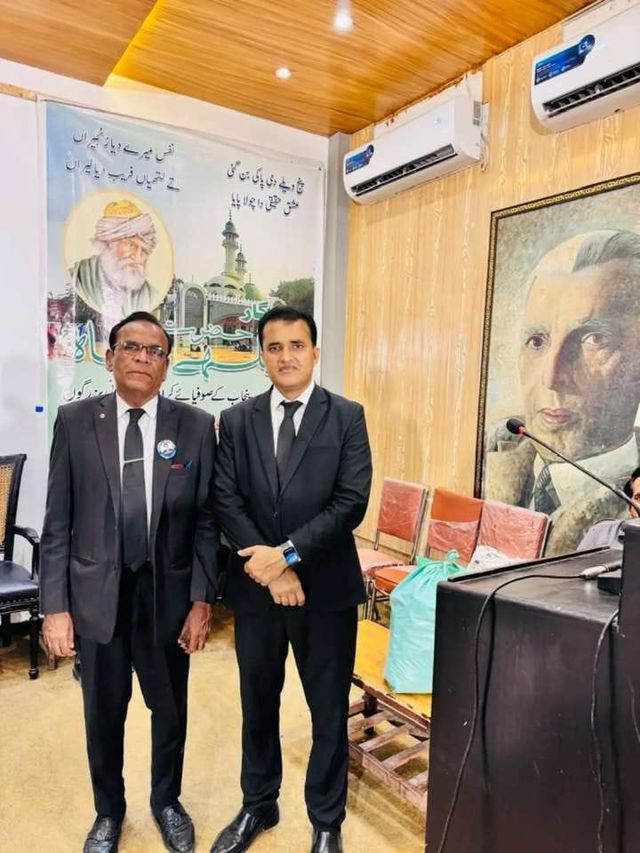 Two advocates at an indoor event