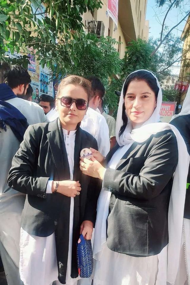 Two advocates outdoors at a public event