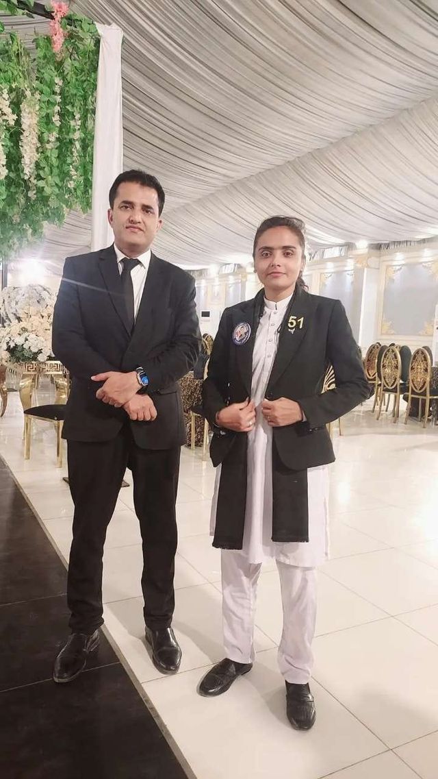 Two advocates at an indoor function