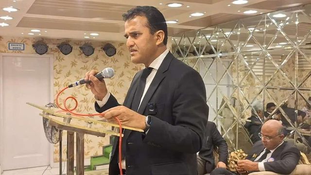 An advocate speaking at a podium